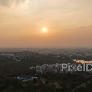 PD0803 - Hazy Sunset Aerial Over an Urban Forest