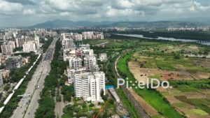 PD0999 - Aerial Pan of Suburban Cityscape with Commuter Train and Highway