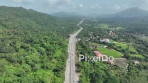 PD1032 - Aerial Drone Flight Over NH 48 (Mumbai-Ahmedabad Highway) Through Green Mountains