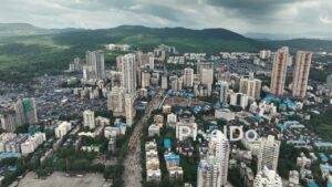 PD1087 - Aerial Drone Flight Over Goregaon East Cityscape and Mountains