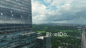 PD1086 - Aerial Drone Reveal of Modern Glass Facade Tower in Goregaon, Mumbai