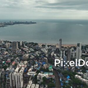 PD1118 - Aerial Drone Pan Over Mumbai Cityscape with Marine Drive and Girgaon Chowpaty