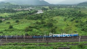 PD1110 - Aerial Drone Pan of Freight Train in Scenic Mountain Valley