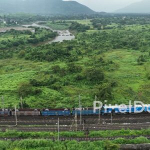 PD1110 - Aerial Drone Pan of Freight Train in Scenic Mountain Valley