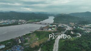 PD1095 - Aerial Drone View of Highway Bridge Spanning a River in a Mountain Valley