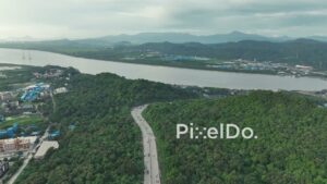 PD1094 - Aerial Drone Flight Over Scenic Highway, Forested Hill, and River