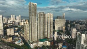 PD1125 - Aerial Drone Flight Towards Mumbai's Dense Skyscraper Skyline