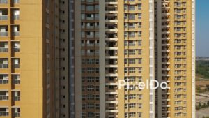 PD1157 - Aerial Drone Pullback Revealing Facade of Modern High-Rise Tower