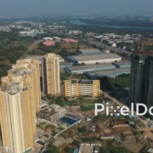 PD1156 - Aerial Drone Pullback of High-Rise Construction and Industrial Estate