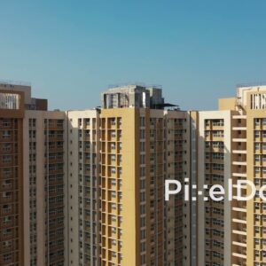 PD1155 - Aerial Drone Rise Over Modern High-Rise Residential Towers
