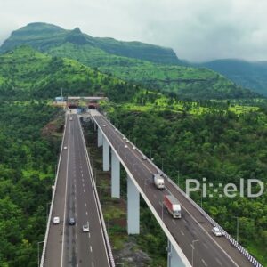 PD1178 - Aerial Drone Rise Over Samruddhi Mahamarg Viaduct and Mountain Valley