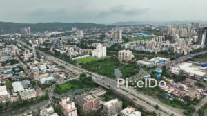 PD1169 - Aerial Drone Pan of Vashi Cityscape with Sion Panvel Highway and Inorbit Mall