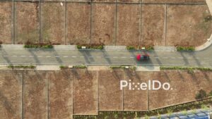 PD1160 - Top-Down Aerial Drone Tracking Red Car in New Land Development