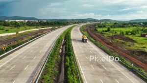 PD1192 - Dynamic Drone Flight Over Scenic Expressway in Mountain Valley