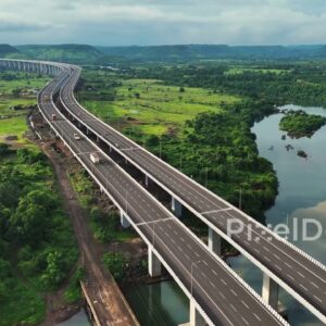 PD1191 - Aerial Drone Pullback of Expressway Viaduct Over River and Green Valley