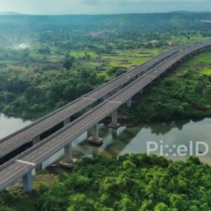 PD1190 - Aerial Drone Pan of Curving Expressway Viaduct in Scenic Green Valley
