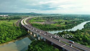 PD1189 - Aerial Drone Pan of Curving Expressway Bridge and River
