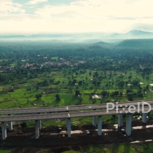 PD1185 - Aerial Drone Pan of Curving Expressway Viaduct in Green Valley
