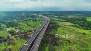 PD1183 - Aerial Drone Flight Over Curving Expressway Viaduct in Green Valley