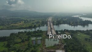 PD1028 - Aerial View of a New Megastructure Bridge Under Construction Over a River