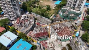 PD1007 - Aerial Orbit of a Large Urban Construction Site with Tower Crane