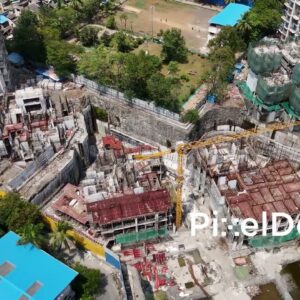 PD1007 - Aerial Orbit of a Large Urban Construction Site with Tower Crane