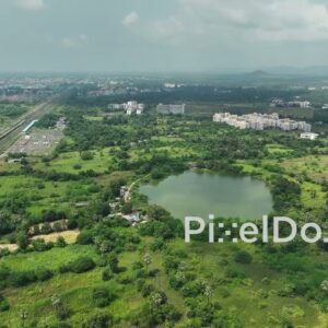 PD1059 - Aerial Drone Flight Over Scenic Lake and Suburban Landscape