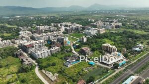 PD1057 - Aerial Drone Pan of Suburban Residential Township with Mountain Backdrop