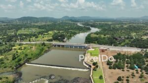 PD1051 - Aerial Drone Flight Over River Dam, Bridge, and Scenic Mountain Landscape