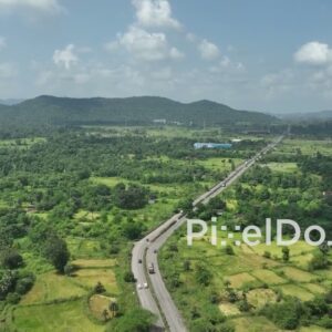 PD1044 - Aerial Drone View of Highway Winding Through Rural Mountain Valley