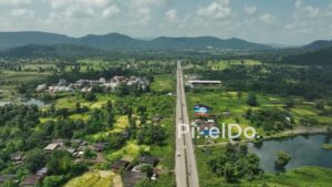 PD1043 - Aerial Drone Flight Over Scenic Rural Highway and Mountain Valley