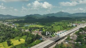 PD1042 - Aerial Drone Pan Showing Highway Exit to Countryside Road