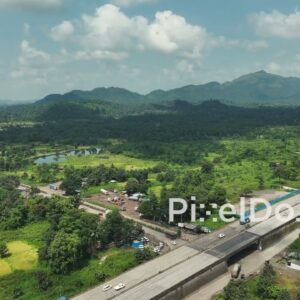 PD1042 - Aerial Drone Pan Showing Highway Exit to Countryside Road
