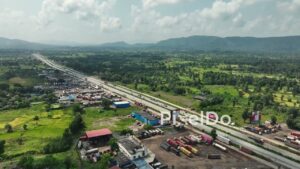 PD1040 - Aerial Drone Flight Over Busy Highway and Logistics Hub