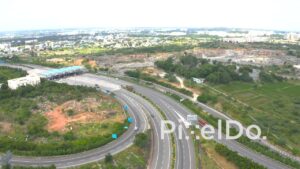 PD1278 - Aerial View of Modern Highway Interchange with Curved Ramps and Toll Plaza