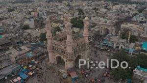 PD1269 - Aerial Orbit View of Charminar Monument and Bustling Market Square