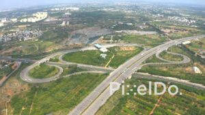 PD1316 - Aerial View of Large Highway Cloverleaf Interchange and Traffic