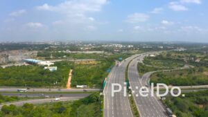 PD1314 - Aerial View of Wide Multi-Lane Expressway and Green Landscape
