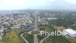 PD1342 - Aerial View of Straight Urban Avenue Leading to Distant Hill