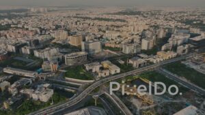 PD1376 - Aerial View of Urban Flyover Network and Sprawling City Skyline