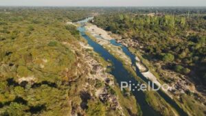 PD1201 - Aerial View of a Scenic River Flowing Through Lush Green Forest Landscape