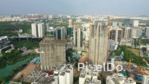 PD1354 - Aerial View of High-Rise Skyscrapers Under Construction and City Skyline