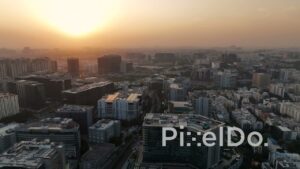 PD1405 - Aerial View of Corporate Skyline and Sprawling City at Sunset