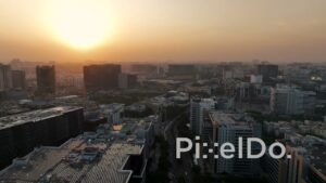 PD1404 - Aerial View of Modern Urban Skyline and Busy Roads at Sunset