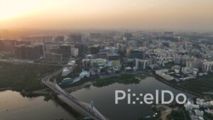 PD1423 - Aerial View of Durgam Cheruvu Bridge and Knowledge City Skyline at Sunset