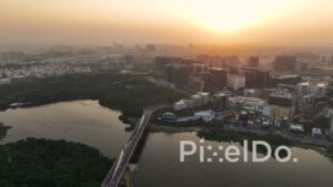 PD1422 - Aerial View of Durgam Cheruvu Cable Bridge and Corporate Skyline at Sunset