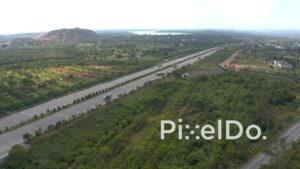 PD1279 - Aerial View of Modern Expressway Stretching Through Green Landscape